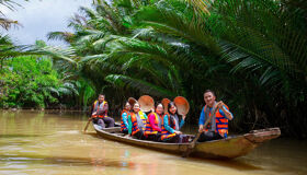 Vibrant Ben Tre orchards in Vietnam for a Ben Tre Tours banner by Legend Travel Group.